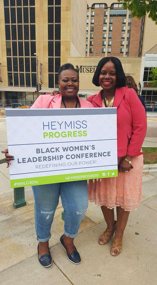 Sabrina Madison - District 17 Alder Madison, WI holding sign about Black Women's Leadership Conference